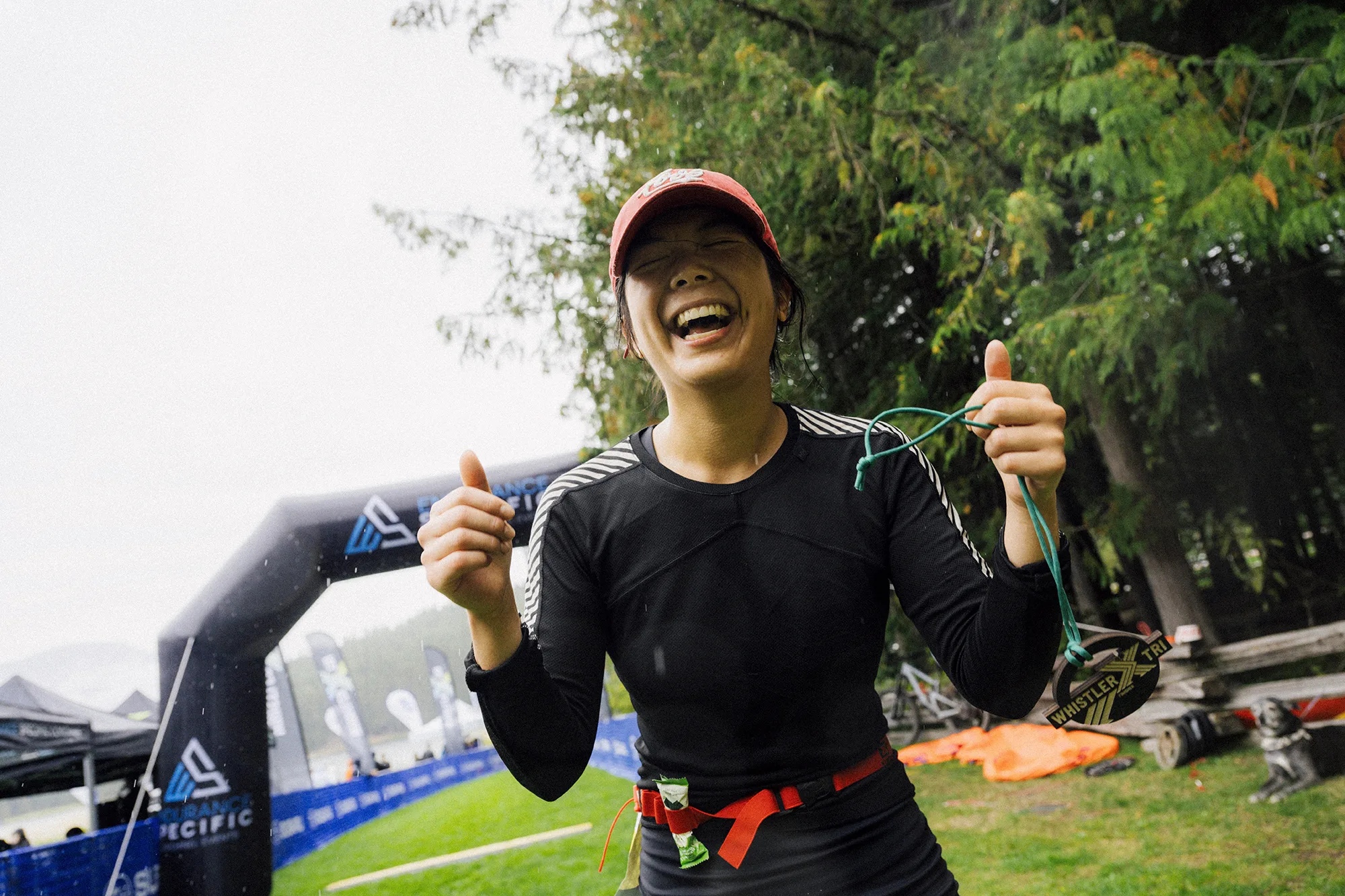 Athlete celebrating at finish line — Whistler X Tri off-road triathlon, formerly XTERRA Whistler